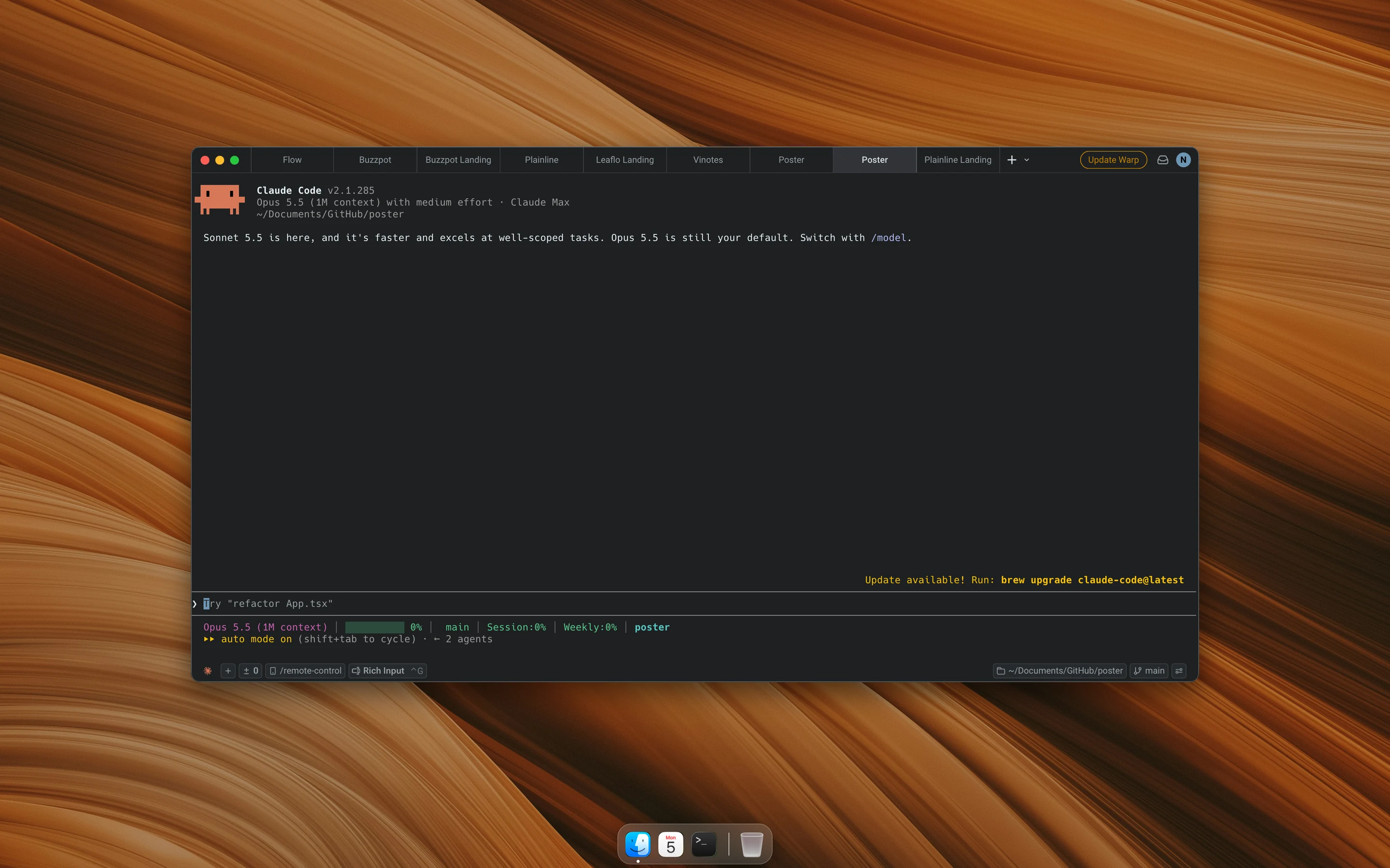 Warp with nine project tabs and a Claude Code session